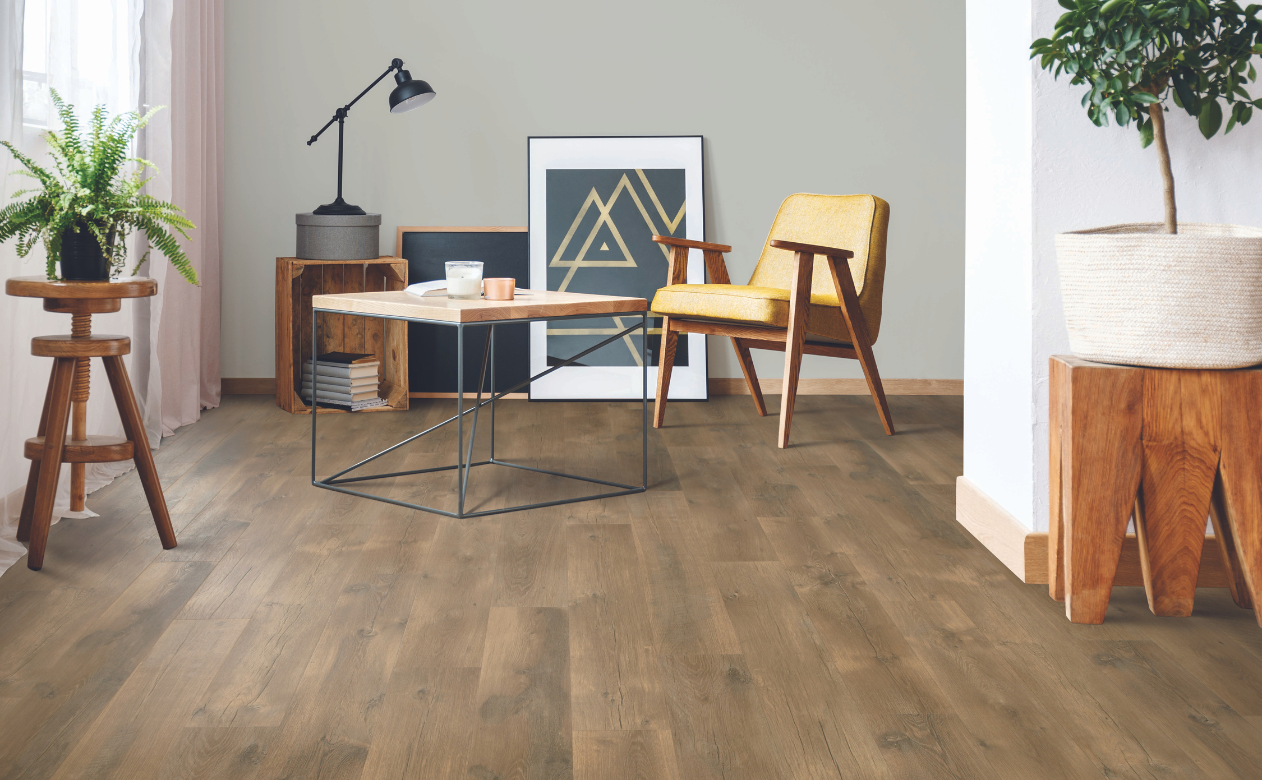 Medium dark laminate plank floor in modern home office. 